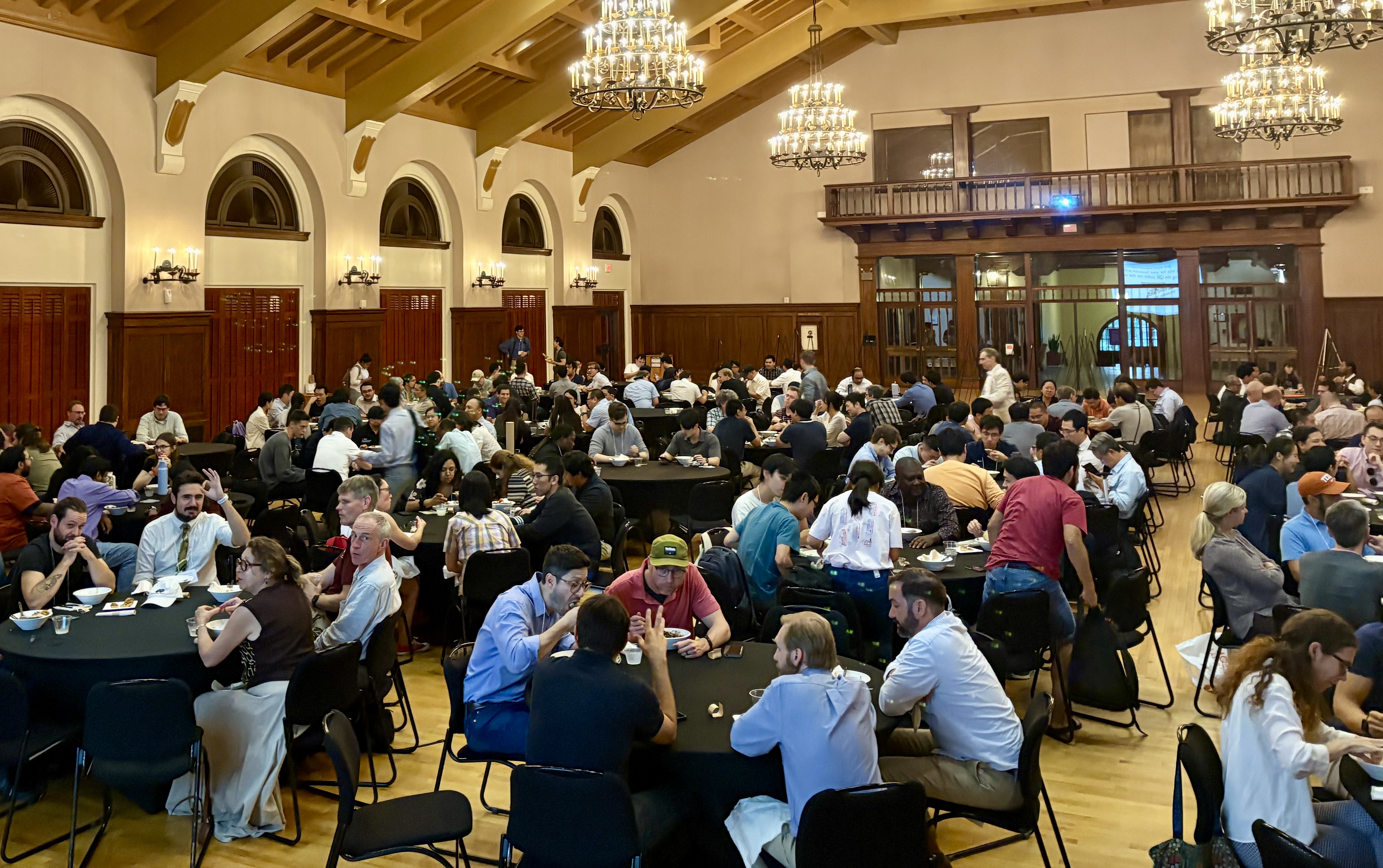 Volunteers welcome attendees. L-r: Yimin Zhu, Jonathan Zhang, Krishnanunni C G.
