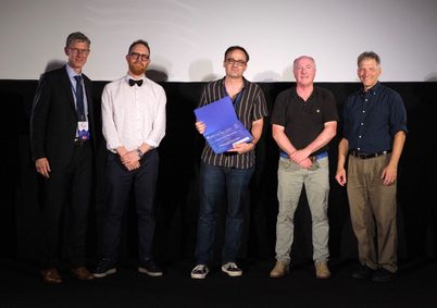 Renato Zanetti (center) accepted the Best Paper Award.